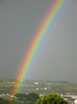 27064 Bright rainbow over fields and houses.jpg